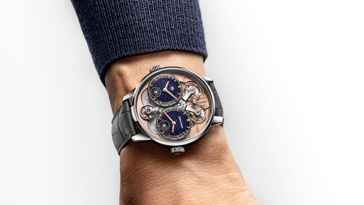 Armin Strom Dual Time GMT Resonance Aventurine worn on the wrist, navy knit sleeve