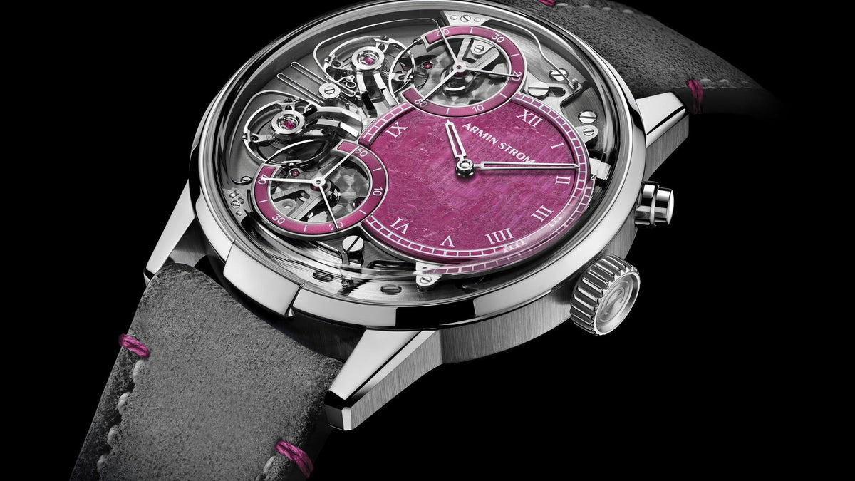Armin Strom Mirrored Force Resonance Ruby with red ruby dial and exposed twin balance wheels, three-quarter view