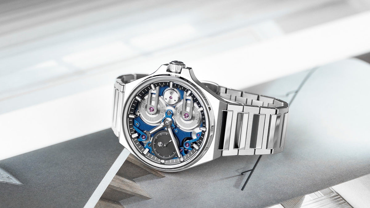 Armin Strom One Week Manufacture Edition Blue resting on a magazine, angled view of the blue mainplate