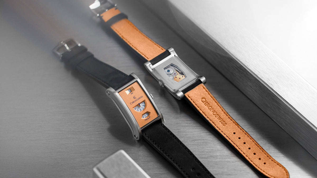 Chronoswiss Neo Digiteur Granit and Sand side by side on brushed steel