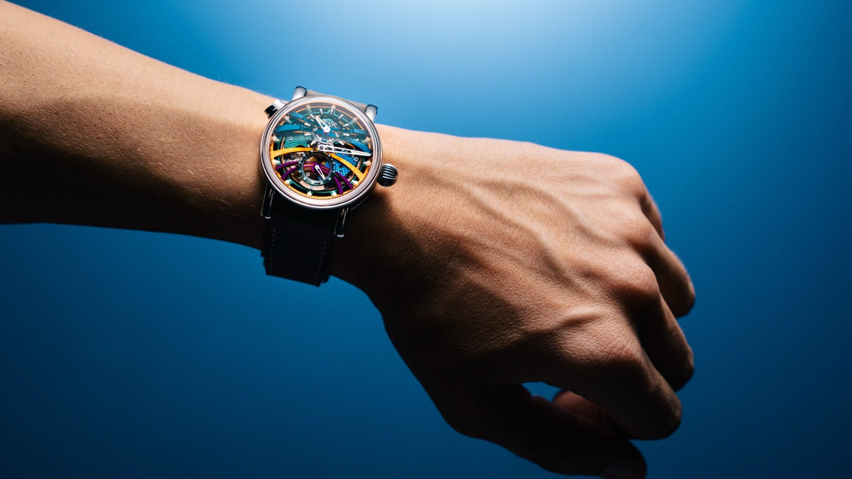 Chronoswiss Q-Repeater Scream worn on the wrist, dramatic blue light, skeletonised multicolour dial