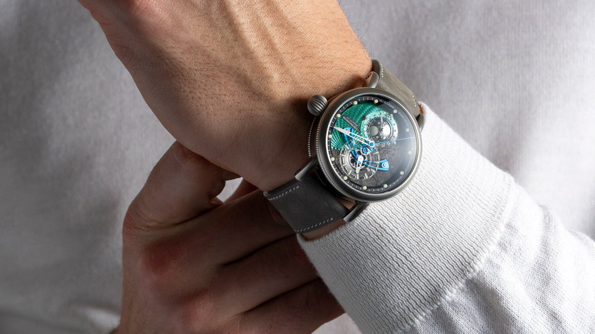 Chronoswiss Space Timer Gravity worn on the wrist, hands adjusting the clasp