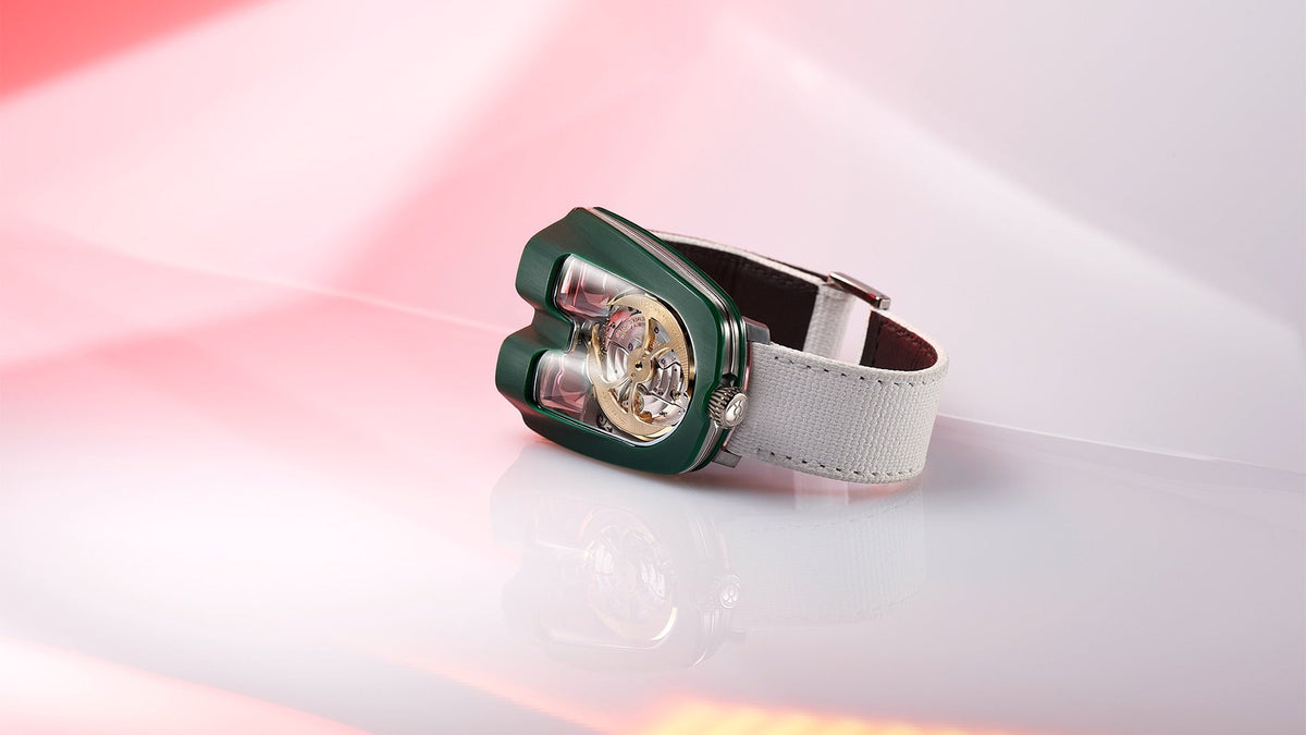 MB&F HM8 Mark 2 in British racing green on a white strap, angled view through the double bubble crystal