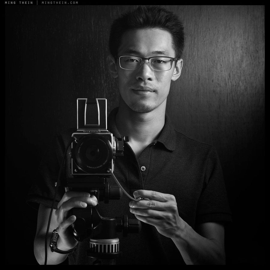 Ming Thein, founder of MING, with a medium-format camera