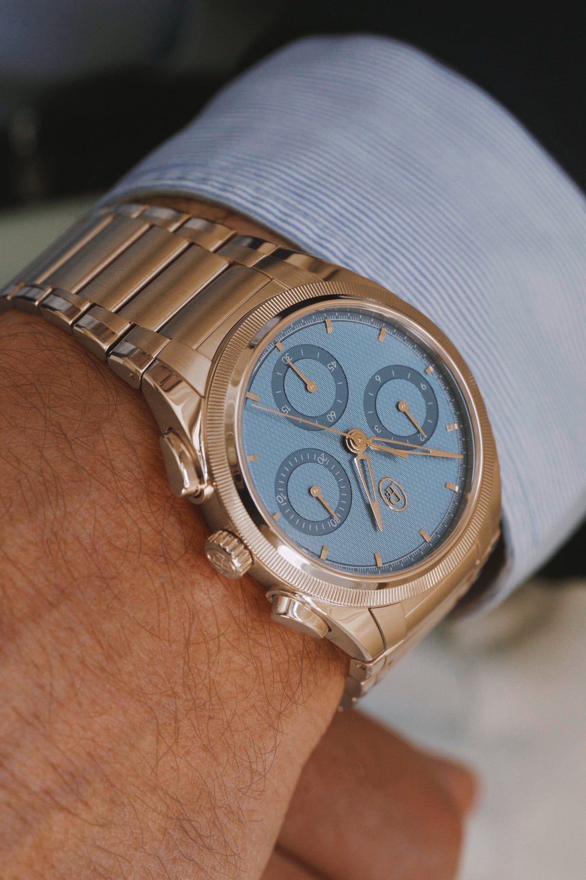 Parmigiani Fleurier TONDA PF Chronograph 40mm worn on the wrist, Mineral Blue dial under a shirt cuff
