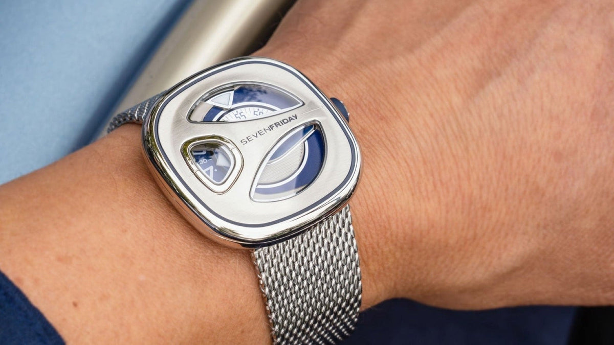SEVENFRIDAY ME-Series ME1/01M on the wrist, blue lacquer bezel groove and steel Milanese bracelet