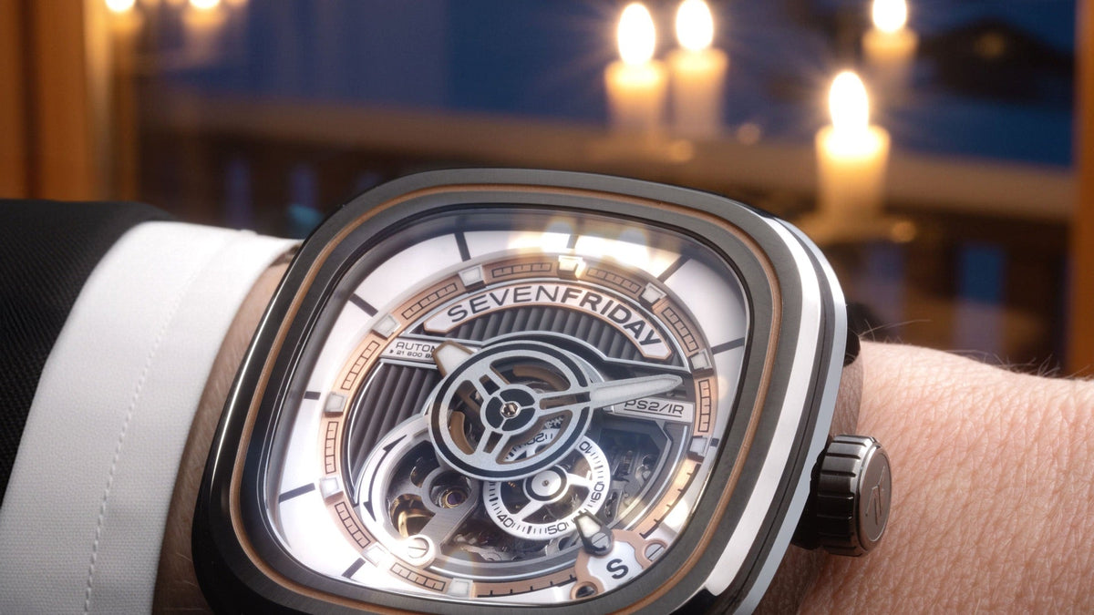 SEVENFRIDAY PS2/03 “BC” on the wrist, dial lit by candlelight, skeletonised dial in close view