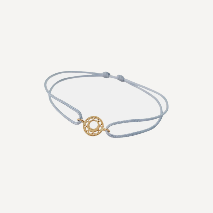 Tiny Om Communication disc bracelet on thread