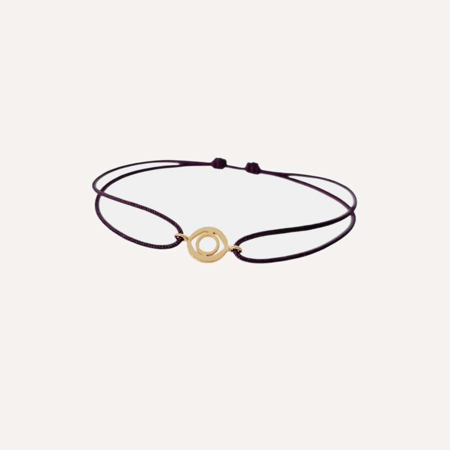 Tiny Om Serenity disc bracelet on thread