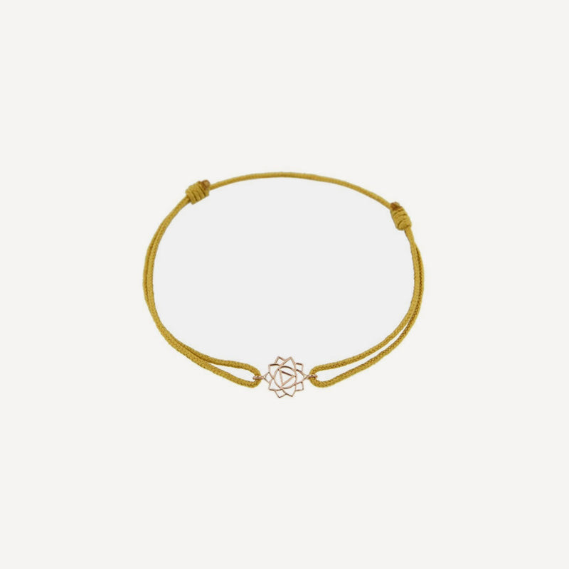 Tiny Om Confidence bracelet on thread Chakra